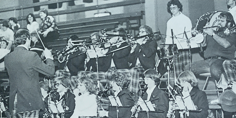 Dr. Terry Milligan conducts the Northwest pep band at a Bearcat basketball game during the 1978-79 school year. (1979 Tower yearbook) 