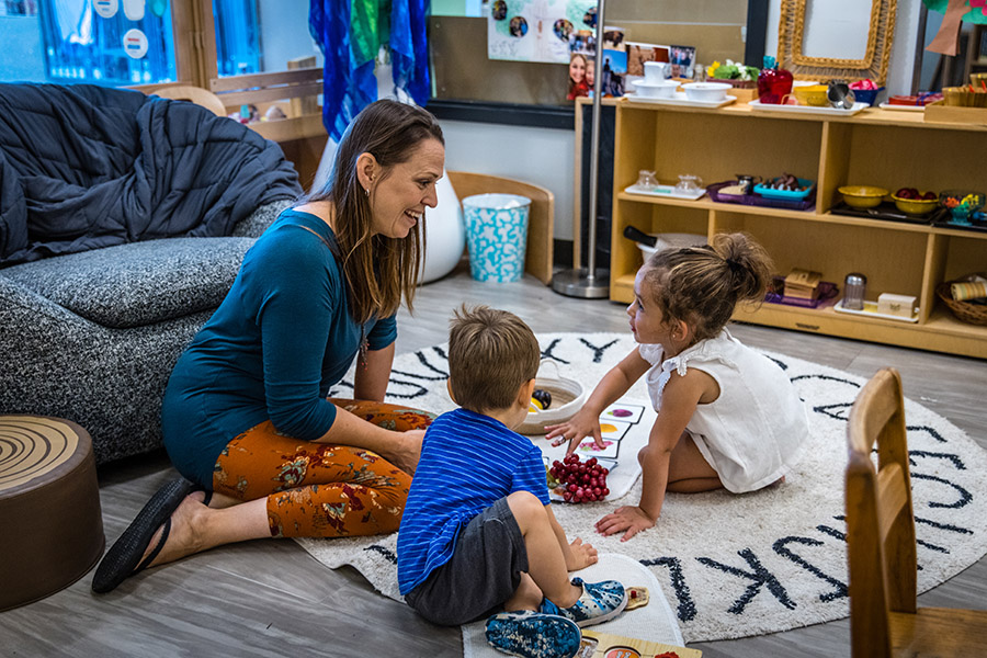 Racheal Wood, an associate teacher in the infant-toddler area, and staff adapt activities and the composition of rooms as children grow and develop.