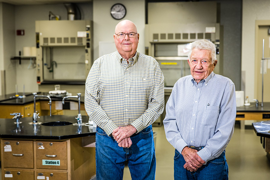 Dr. Harlan Higginbotham and Dr. Ed Farquhar are pictured in a Garrett-Strong Science Building laboratory. In addition to earning their bachelor's degrees from Northwest, both served as chemistry faculty for more than 35 years. (Photo by Lauren Adams/Northwest Missouri State University)  