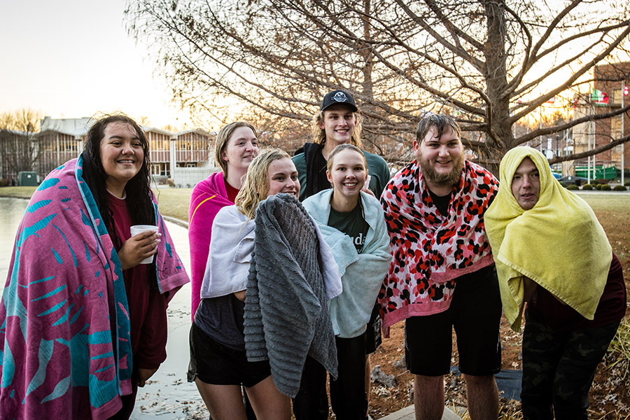 Northwest students who jumped Thursday into Colden Pond during an annual fundraiser for St. Jude Children’s Research Hospital are pictured at the conclusion of the event. Left to right in the front row are Kayla Shelton Torres, Chloe DeVries, Morgan Picht, Dillon Davis and Garrison Kennedy. In the back row are Liz Swafford and Luke Picht. (Photo by Lauren Adams/Northwest Missouri State University)