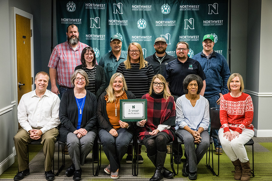 Front row, left to right:
Scott Kuhlemeyer, director of capital programs, Facility Services;
Dr. Debra Brown, assistant professor of music and associate chair, Department of Fine and Performing Arts;
Dr. Tamara Lynn, assistant professor of professional education, School of Education;
Melissa Cook, assistant director of systems and operations, Office of Financial Assistance;
Gina Smith, office manager, School of Health Science and Wellness;
Alisa Meyer, admissions specialist, Office of Admissions.

Middle row, left to right:
Adrianna Bennett, library circulation specialist, B.D. Owens Library;
Jill Brown, director of corporate relations and major gift officer, Office of University Advancement;
Jacob Wood, student affairs coordinator, Office of Student Affairs.

Back row, left to right:
Matt Bax, instructor, School of Agricultural Sciences;
Thomas Dean, HVAC technician, Facility Services;
Jarod Hilsabeck, groundskeeper, Facility Services;
Tyler Steele, project manager, Facility Services.