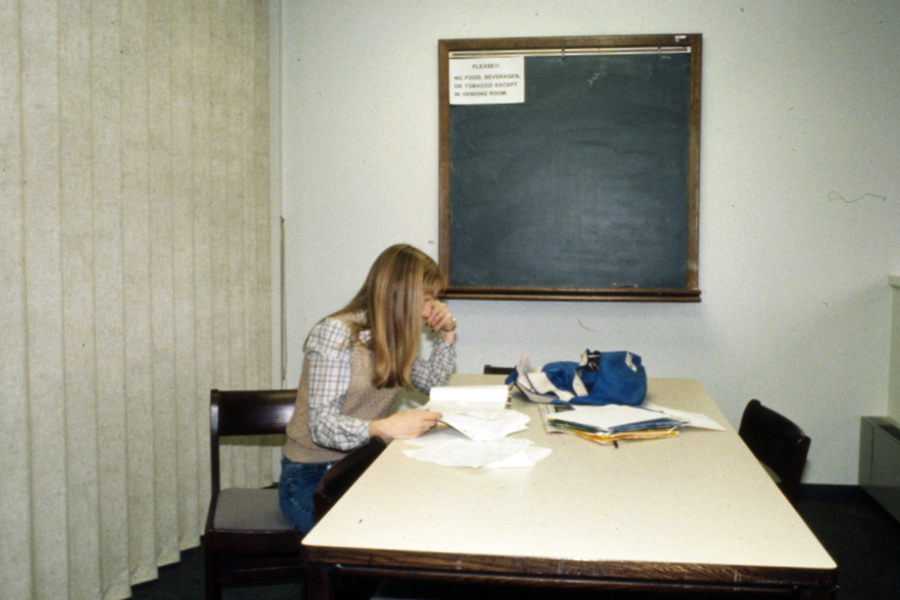 A student studies in the Owens Library during the 1980s. (University Archives)