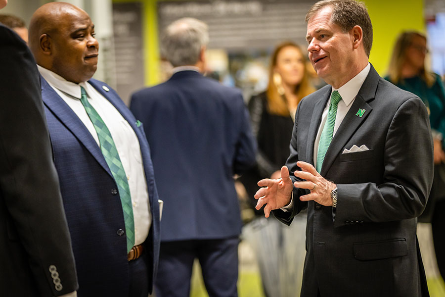 Dr. Clarence Green, left, joins Dr. Lance Tatum for conversation with Northwest community members Thursday.