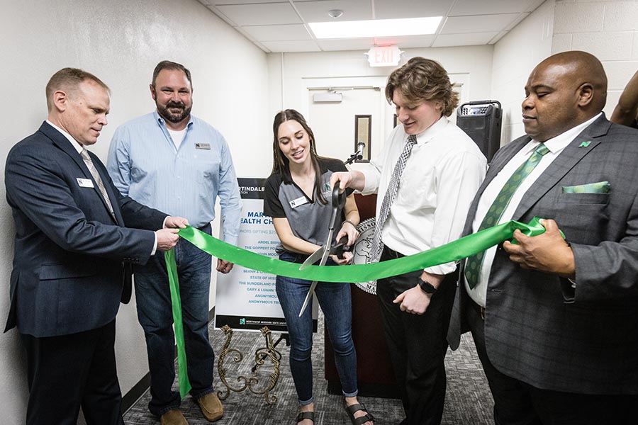 Left to right are Dr. Terry Long, Corey Strider, Elizabeth Motazedi, Dawson Parks and Dr. Clarence Green as they cut a ribbon Thursday celebrating the completion of a third-floor renovation of Martindale Hall. (Photos by Lauren Adams/Northwest Missouri State University)
