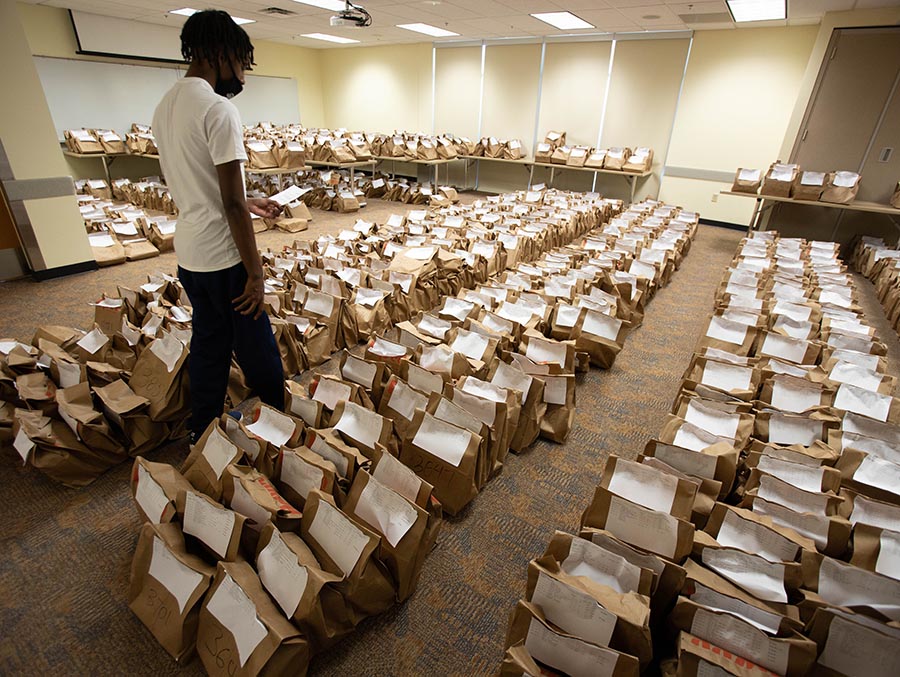 A students picks up textbooks for the start of the academic year at Northwest. (Photo by Todd Weddle/Northwest Missouri State University)