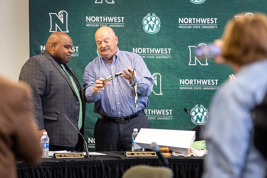 John Moore, the chair of the Board of Regents (right) presented Dr. Clarence Green with an updated Presidential Chain-of-Office that now includes his name in recognition of his term as the University's interim president. (Photos by Todd Weddle/Northwest Missouri State University)
