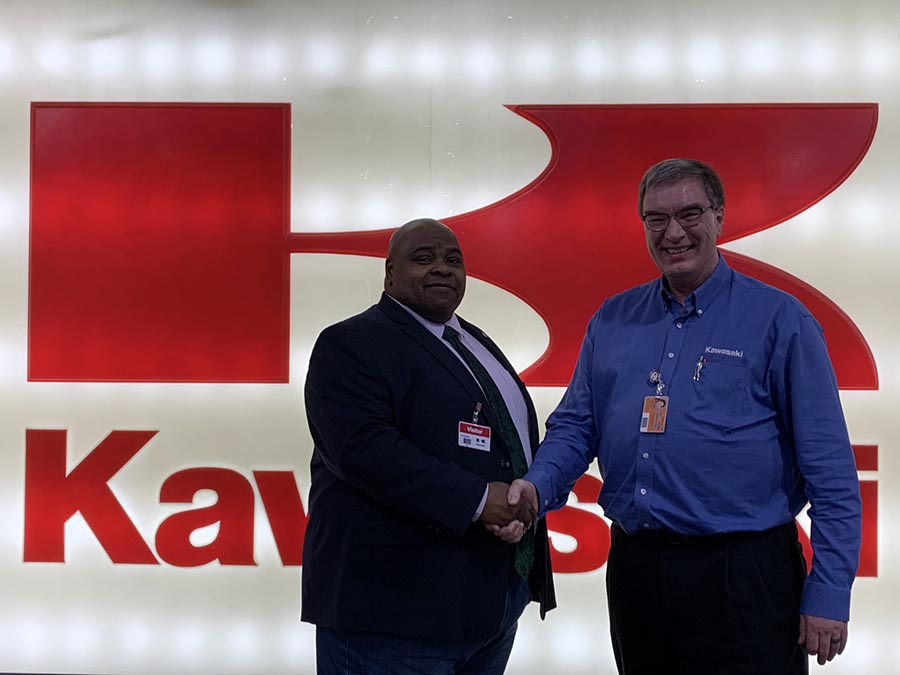 Dr. Clarence Green, who served as Northwest's interim president during the 2022-23 academic year, shakes a hand of Tim Melvin, manager of human resources at Kawasaki, this spring during meeting to celebrate Kawasaki's continued support of the University. (Northwest Missouri State University photo)