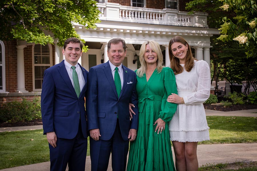 The Tatum family is pictured in front of the historic Thomas Gaunt House, which serves as the presidential residence on the Northwest campus. (Photo by Todd Weddle/Northwest Missouri State University)