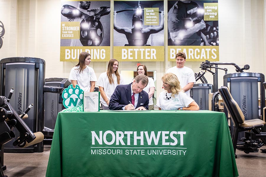 Northwest President Dr. Lance Tatum signed a proclamation Monday, registering Northwest as an Exercise is Medicine campus. He was joined by Assistant Professor of Health and Physical Education Dr. Tina Pulley and student leaders, left to right, Brooke Katen, Ginni Lyman, Reese McGlasson and Dawson Parks. (Photos by Todd Weddle/Northwest Missouri State University)