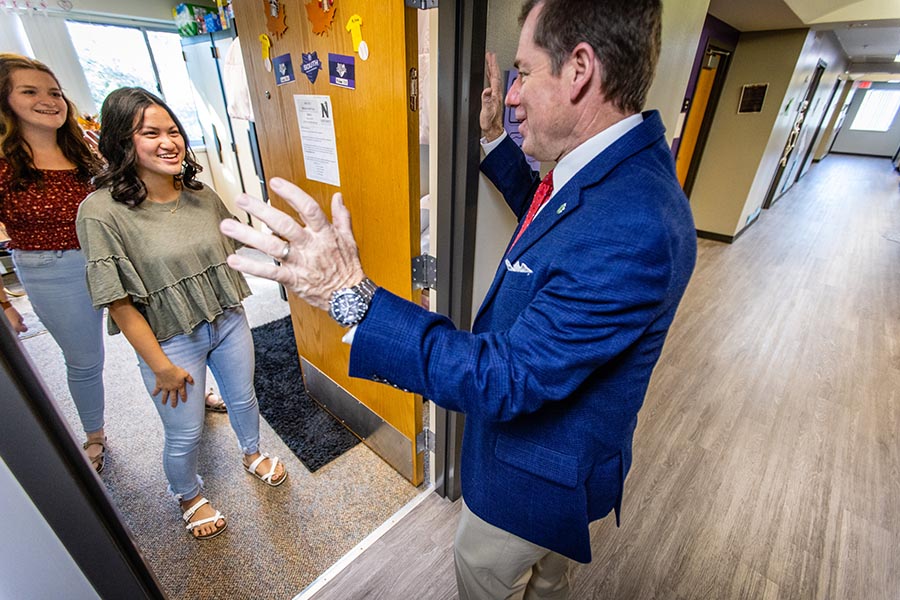 From left, Black and Crites welcomed President Tatum into their room.