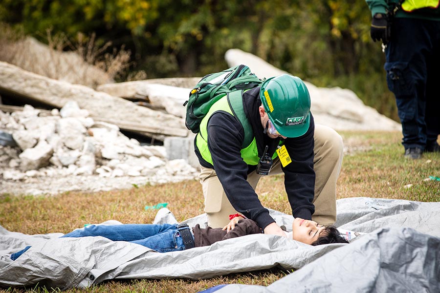A first responder assists a victim during Friday's annual Missouri Hope emergency response field training exercise. (Photo by Lauren Adams/Northwest Missouri State University)