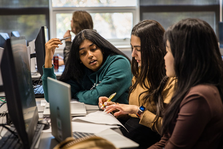 Northwest students discuss a task during a software engineering principles course. (Photo by Lauren Adams/Northwest Missouri State University)