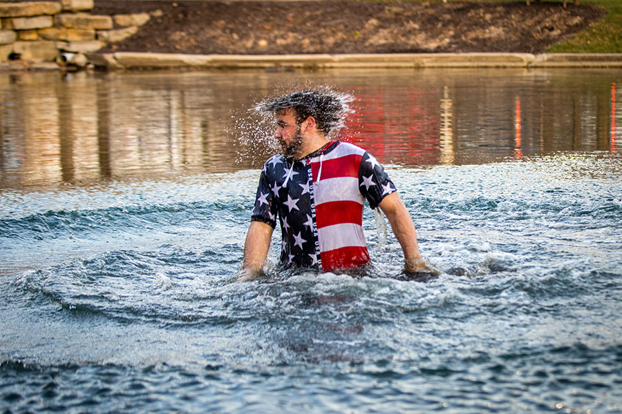 Robert Keays rises above the surface of Colden Pond after taking his turn to jump in.