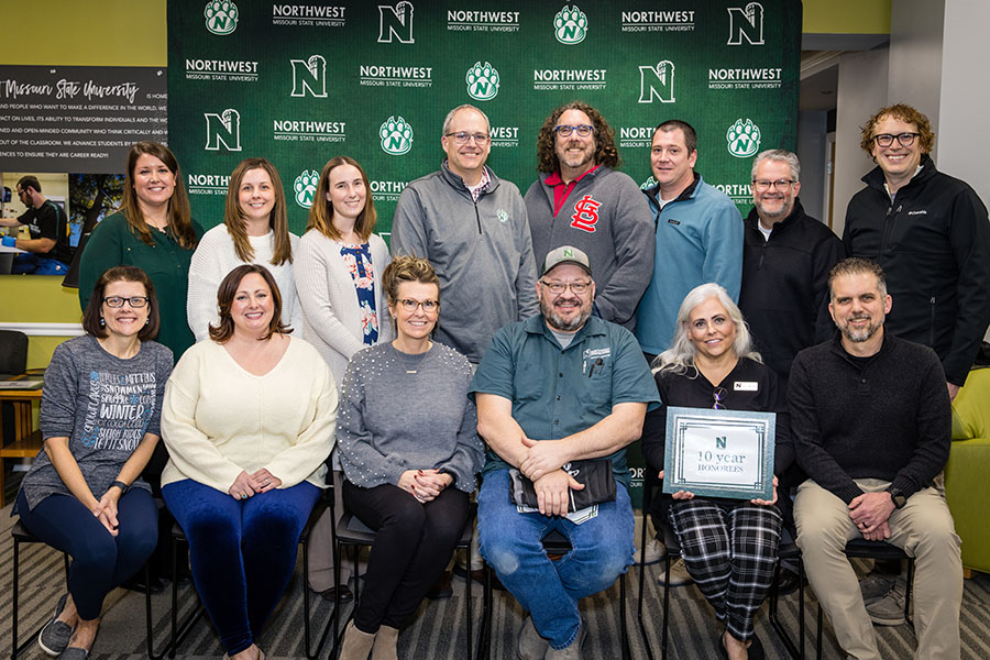Pictured left to right in the front row are Terra Feick, mental health outreach coordinator, Wellness Services; Dr. Ashley Davis-Black, associate professor of English, Department of Language, Literature and Writing; Jaime Collins, office manager, Department of Language, Literature and Writing; Troy Brady, mechanical, electrical and plumbing supervisor, Facility Services; Andrea Mason, K-6 curriculum design and reading, Horace Mann Laboratory School; Dr. Robert Voss, associate professor of history, Department of Humanities and Social Sciences.
In the back row are Denise Workman, director of accounting and budget, Office of Finance and Administration; Jennifer Bucy, senior financial and audit analyst, Office of Finance and Administration; Alyssa Pulley, director of purchasing, Office of Finance and Administration; Tye Parsons, grants coordinator, College of Arts and Sciences; Dr. Tim Wall, dean, School of Education; Brandon Stanley, assistant vice president of marketing and communication, Office of University Marketing and Communication; Sam Mason, major gift officer, Office of University Advancement; Dr. Joseph Haughey, associate professor of English, Department of Language, Literature and Writing.