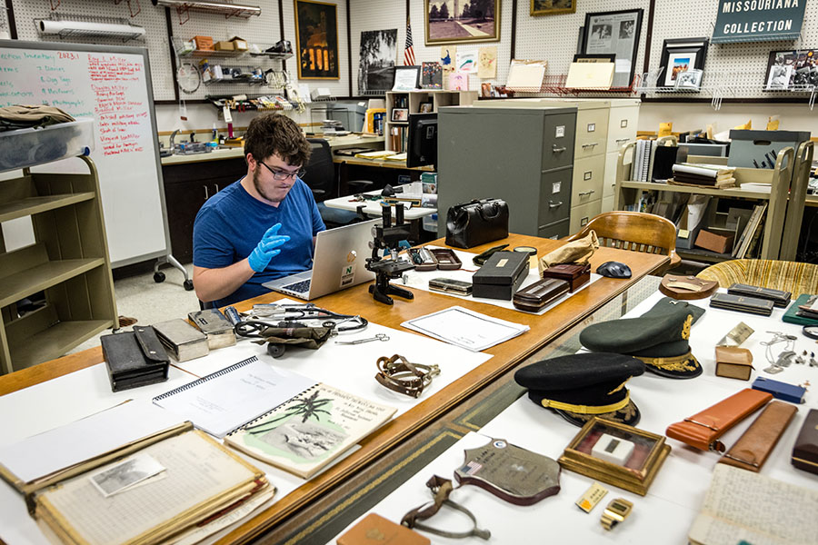 Sam Meservey, a junior history major from Chillicothe, helped catalog Ray Miller’s medical tools as an intern in University Archives.