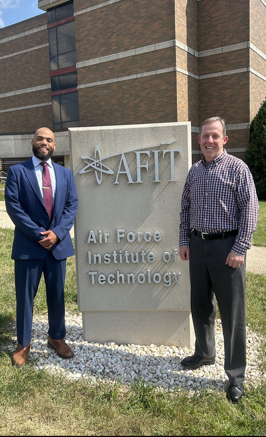 Carson Long (left) is pictured with his doctoral advisor, Dr. Brian Lunday, outside the Air Force Institute of Technology after defending his dissertation last August.
