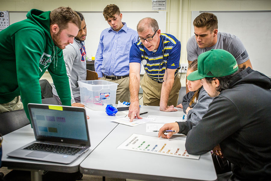 Dr. Matthew Symonds instructs students in a health science abilities lab. (Photo by Todd Weddle/Northwest Missouri State University)