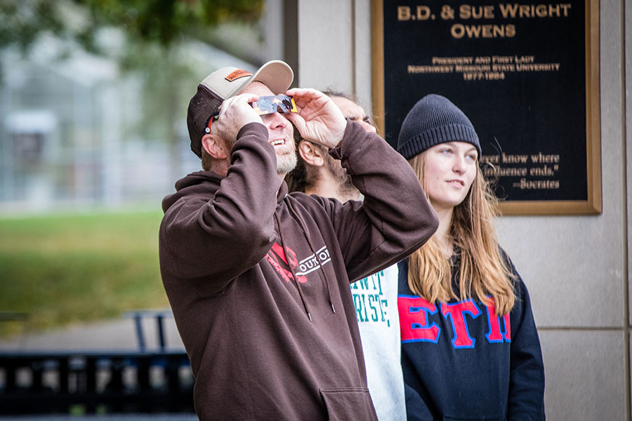 A small group gathered outside the B.D. Owens Library last October to view the Partial Annular Solar Eclipse. (Photo by Chandu Ravi Krishna/Northwest Missouri State University)