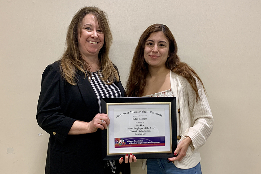 Paula McLain presented Belen Vanegas on Wednesday with a certificate recognizing her as the Midwest Association of Student Employment Administrators’ Diversity and Inclusion Student Employee of the Year runner-up.