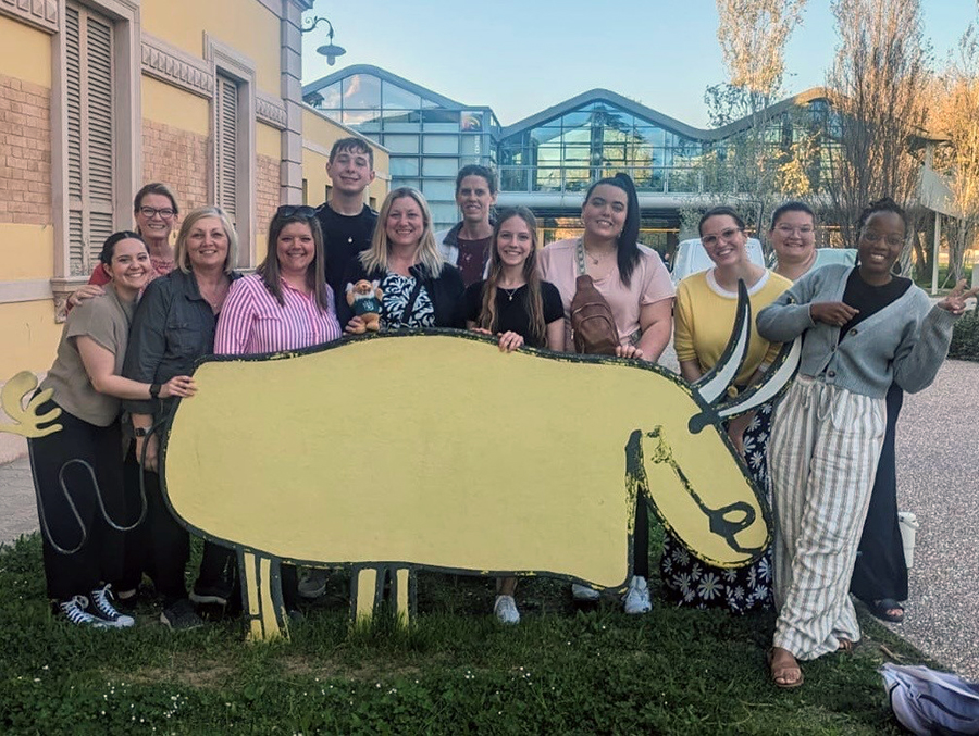 Left to right, Avry Asby, Nissa Ingraham, Sandy Seipel, Becky Moore, Jonathan Rohr, Julie Michaelsen, Jessica Cook, Jenna Cotter, Abbie Johnson, Rachel Radcliff, Katie Thibodeau and Jessica Makona are pictured outside of the Loris Malaguzzi International Centre in Reggio Emilia, where study groups gather daily for lectures. (Submitted photos)