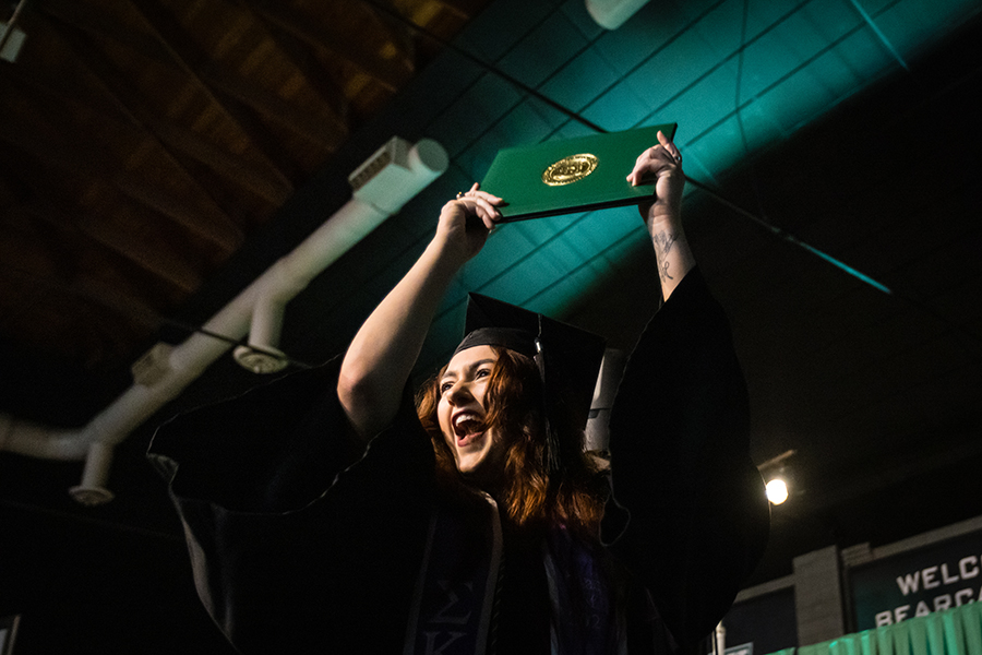 A Northwest graduate shows her diploma cover after one of the University's commencement ceremonies on Saturday.