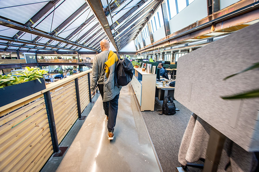 Bilal Clarance walks to his workstation between meetings at one of Google’s office buildings.