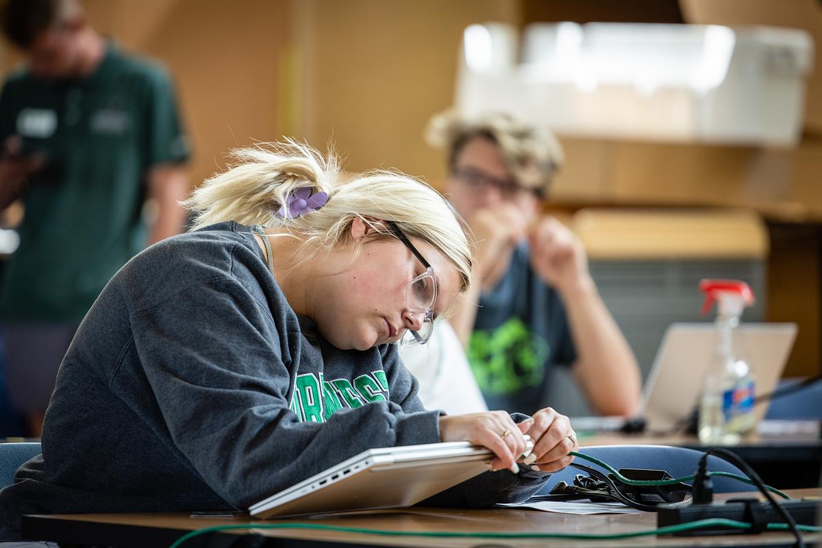 A student at laptop pickup
