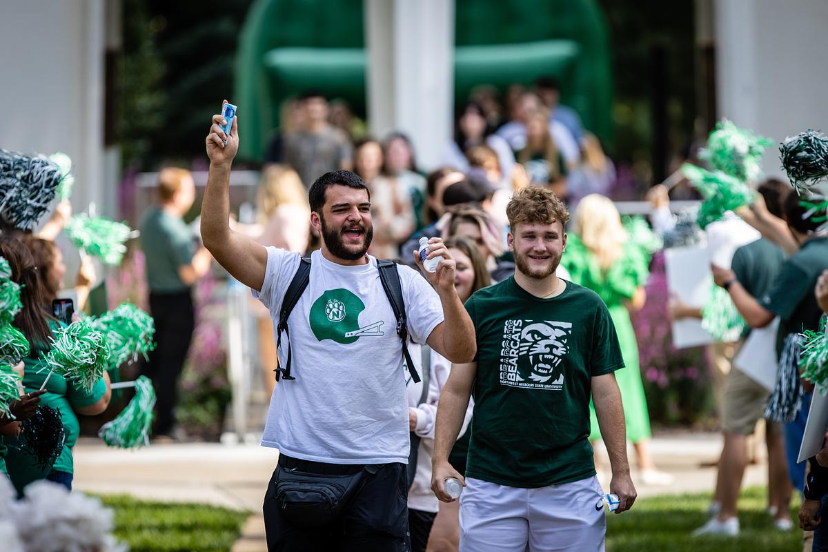 Two students show their excitement during the March to the Tower