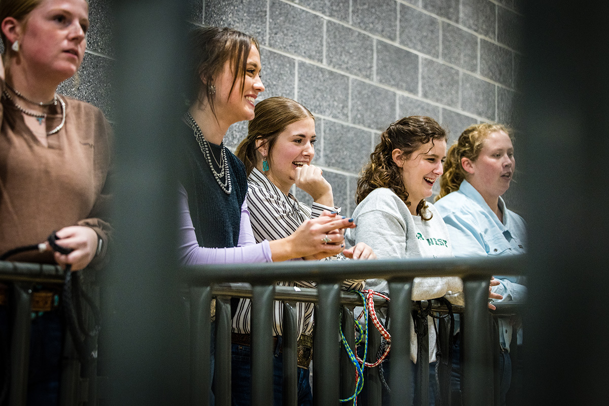 Northwest agriculture students watch from a sideline as their peers competed in the livestock show. (Photo by Todd Weddle/Northwest Missouri State University)