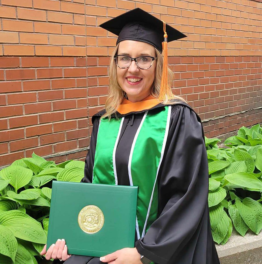Lori Palik is pictured on the Northwest campus after graduating last year with her Master of Science in Nursing degree. (Submitted photo)