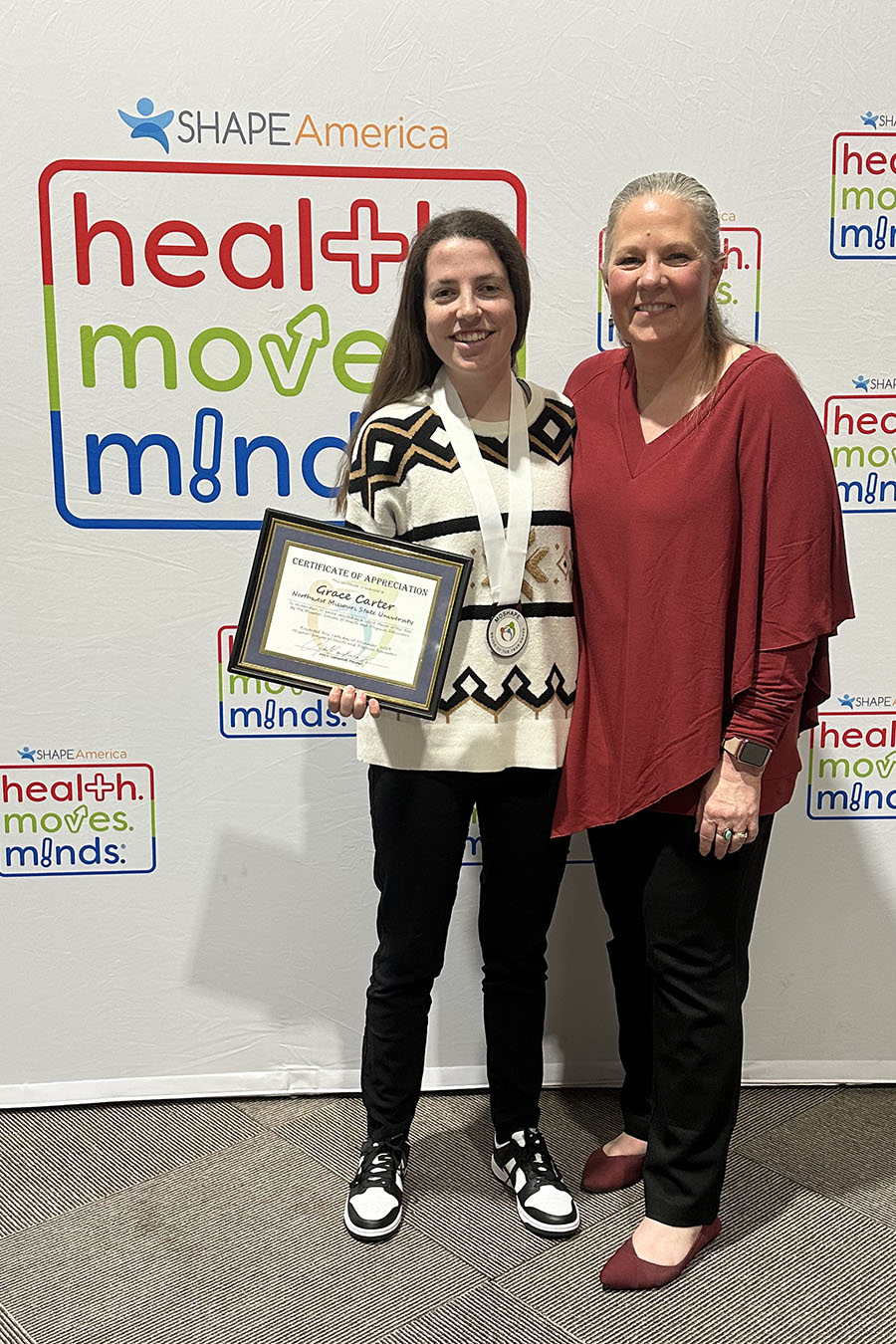 Grace Carter is pictured with Dr. Jodie Leiss at MOSHAPE’s annual conference in November. (Submitted photo)