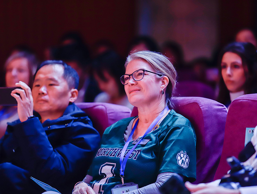 Dr. Nissa Ingraham takes in a presentation during the Northwest group's visit to Hebei Normal University in China. (Photo courtesy of Dr. Shelby Lee/GCBEI)