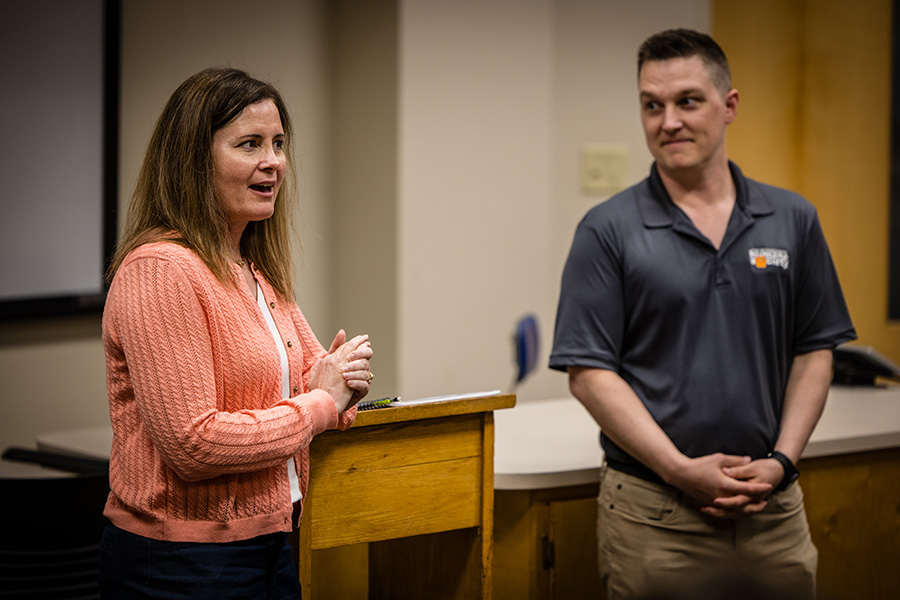 Knacktive faculty member Diana Linville addresses students after results of this spring's pitch competition were announced as New Nodaway Humane Society Board member Wes Rockwood stands by. (Photo by Lilly Cook/Northwest Missouri State University)