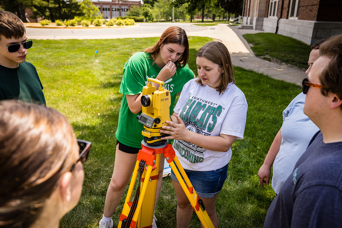 Students in Dr. Arghya Goswami’s geologic field methods class practiced surveying elevation changes June 2 on the Northwest campus. (Photo by Lilly Cook/Northwest Missouri State University)
