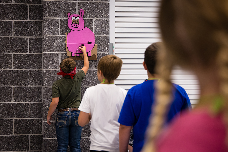 Children participated in a variety of activities and games during the Ag Camp, including turns at pinning a tail on a pig. (Photo By Lilly Cook/Northwest Missouri State University)