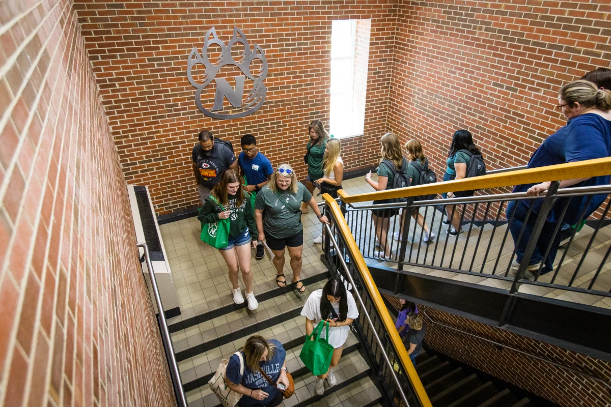 Students and their families take a break for lunch in the Bearcat Commons.